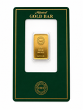 A 5g gold bar displayed in a clear plastic holder on a dark green Minted Gold Bar presentation card with gold lettering, shown against a plain white background.